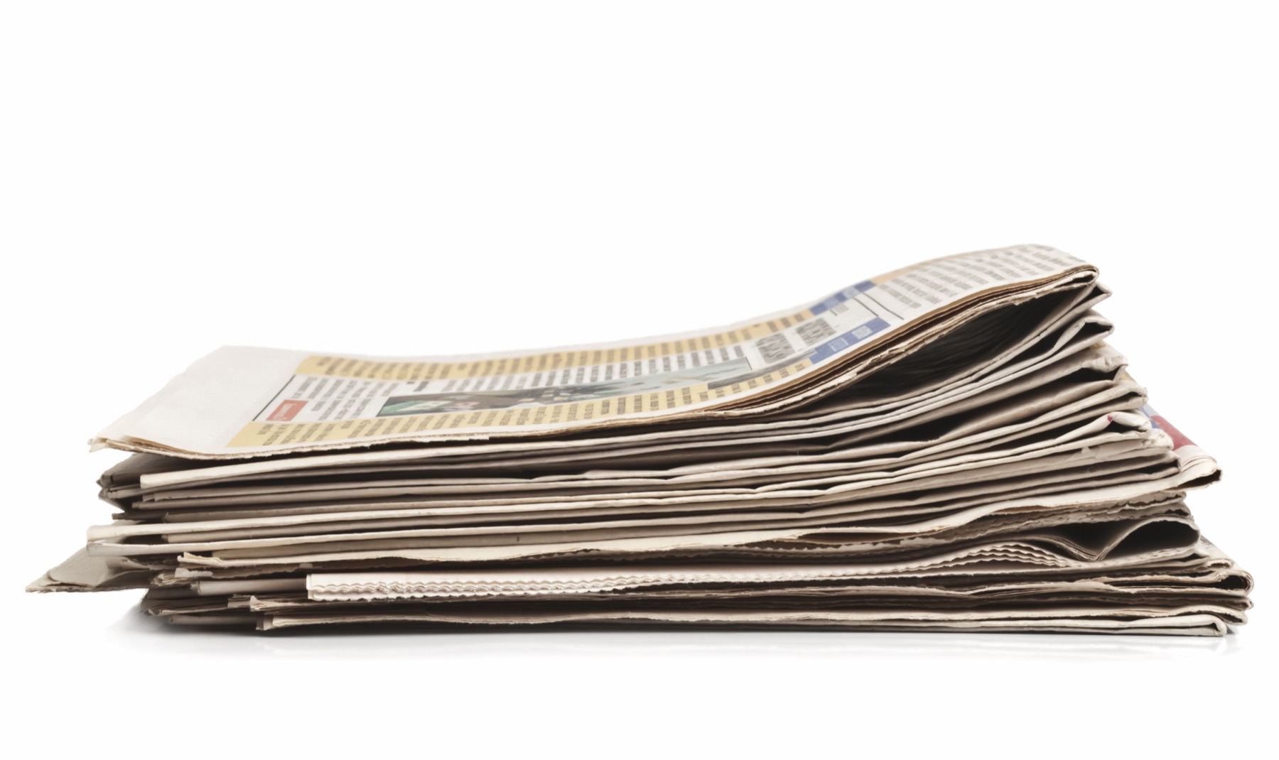 A newspaper printing press running broadsheet pages at speed
