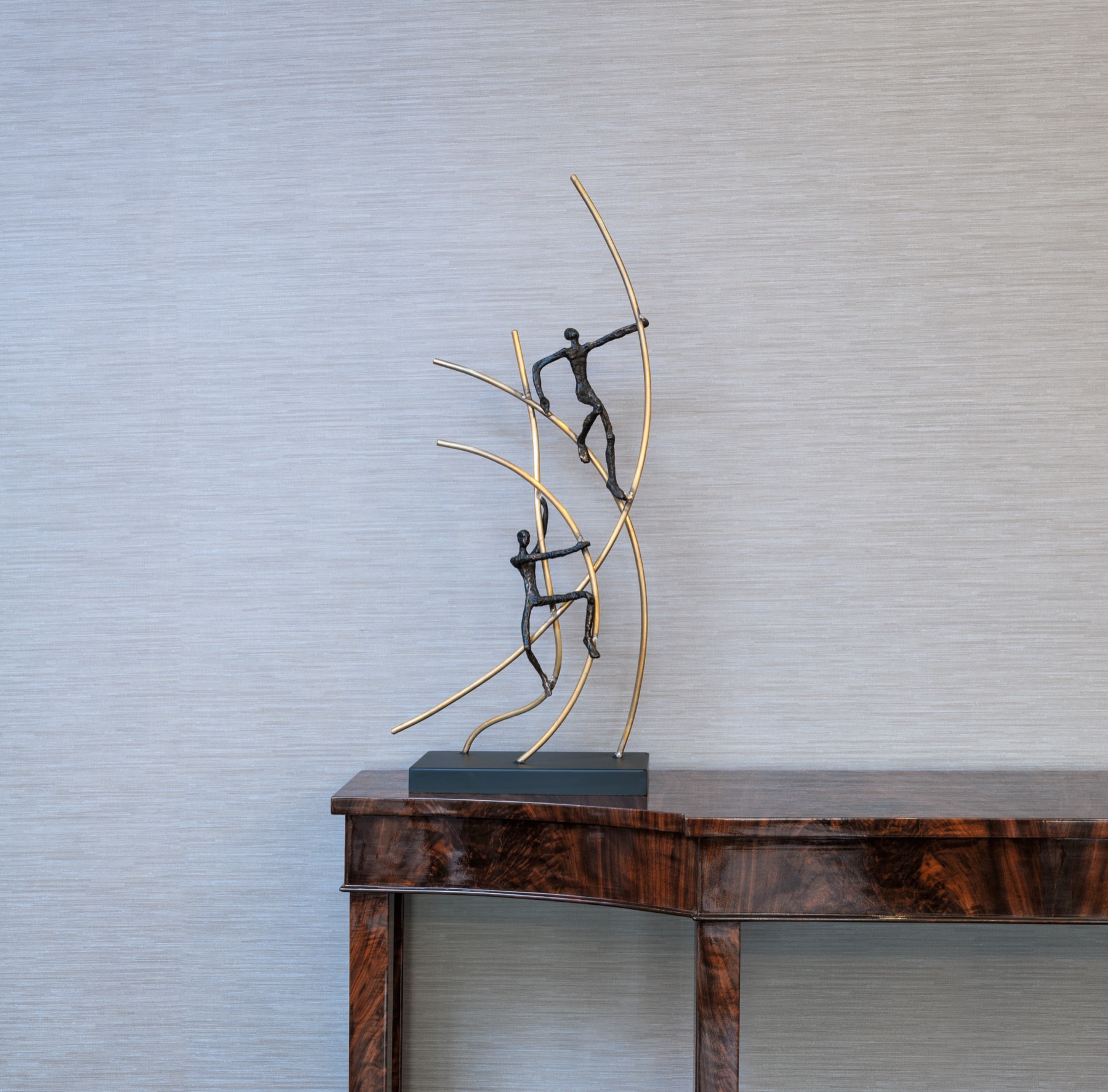 An abstract sculpture of identical curved, interlocked tubular segments twisting into a continuous looping form