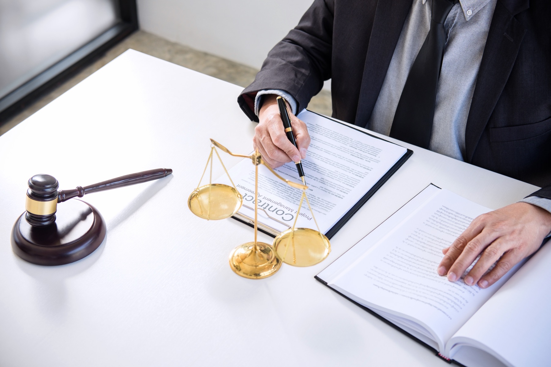 Attorney reviewing a legal invoice at a desk