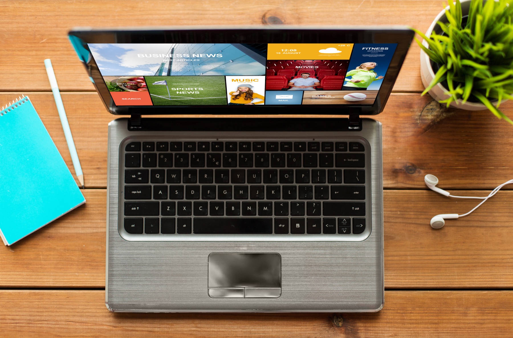 A laptop streaming video content on a desk at night