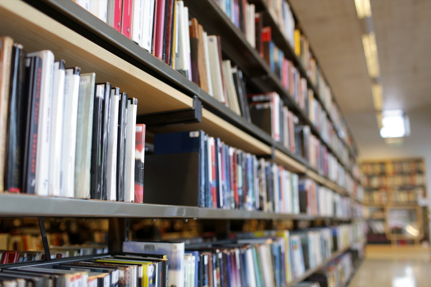 Rows of public library bookshelves
