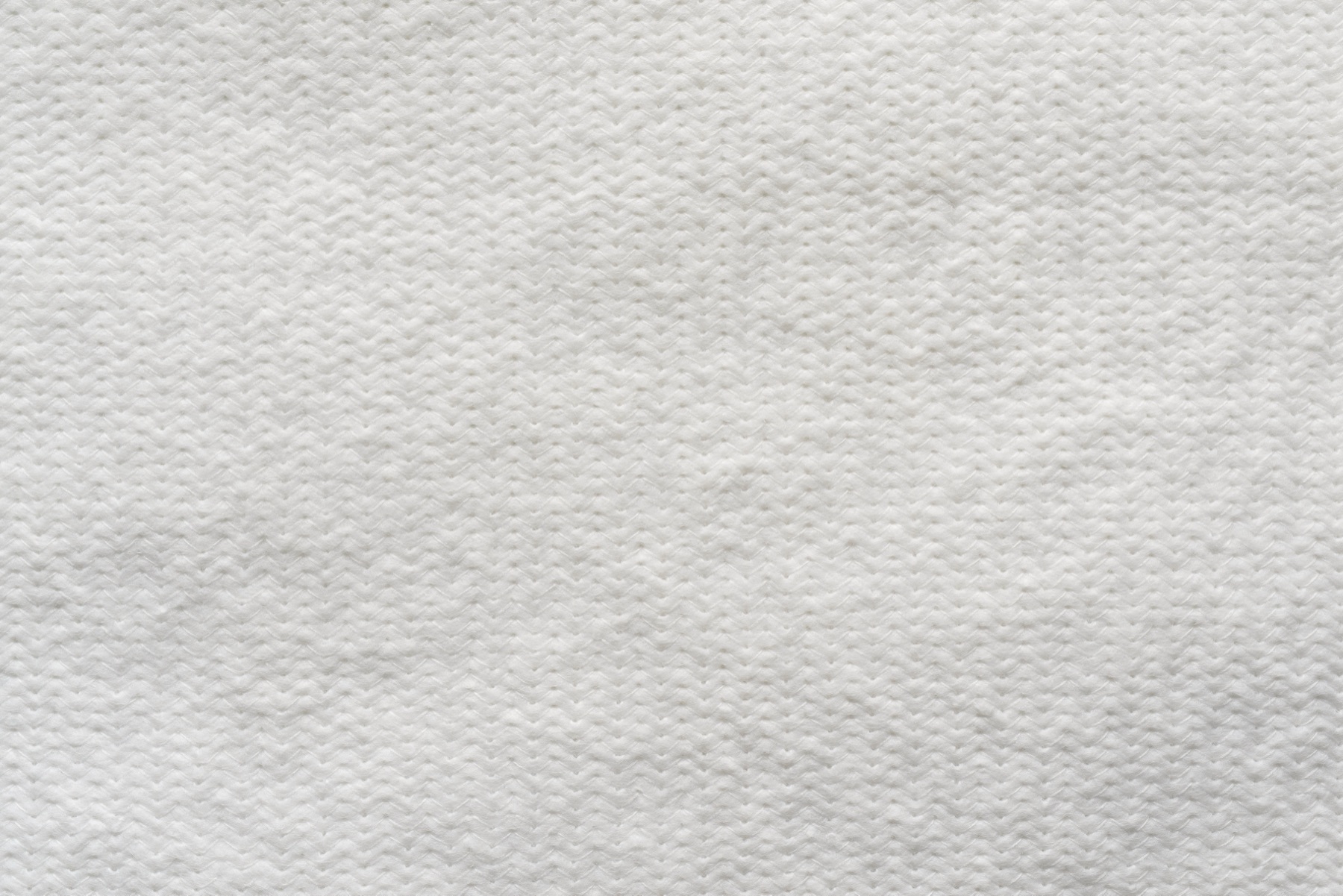 A magnified pattern of tiny dots printed on paper