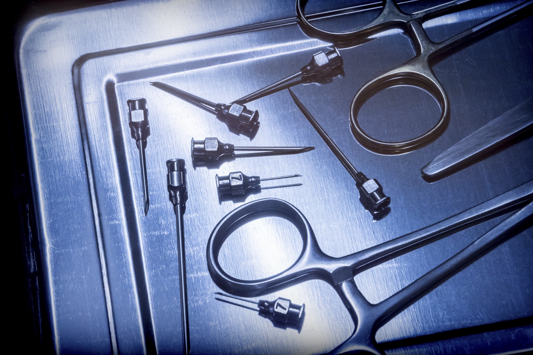 Surgeons using endoscopic instruments in an operating room