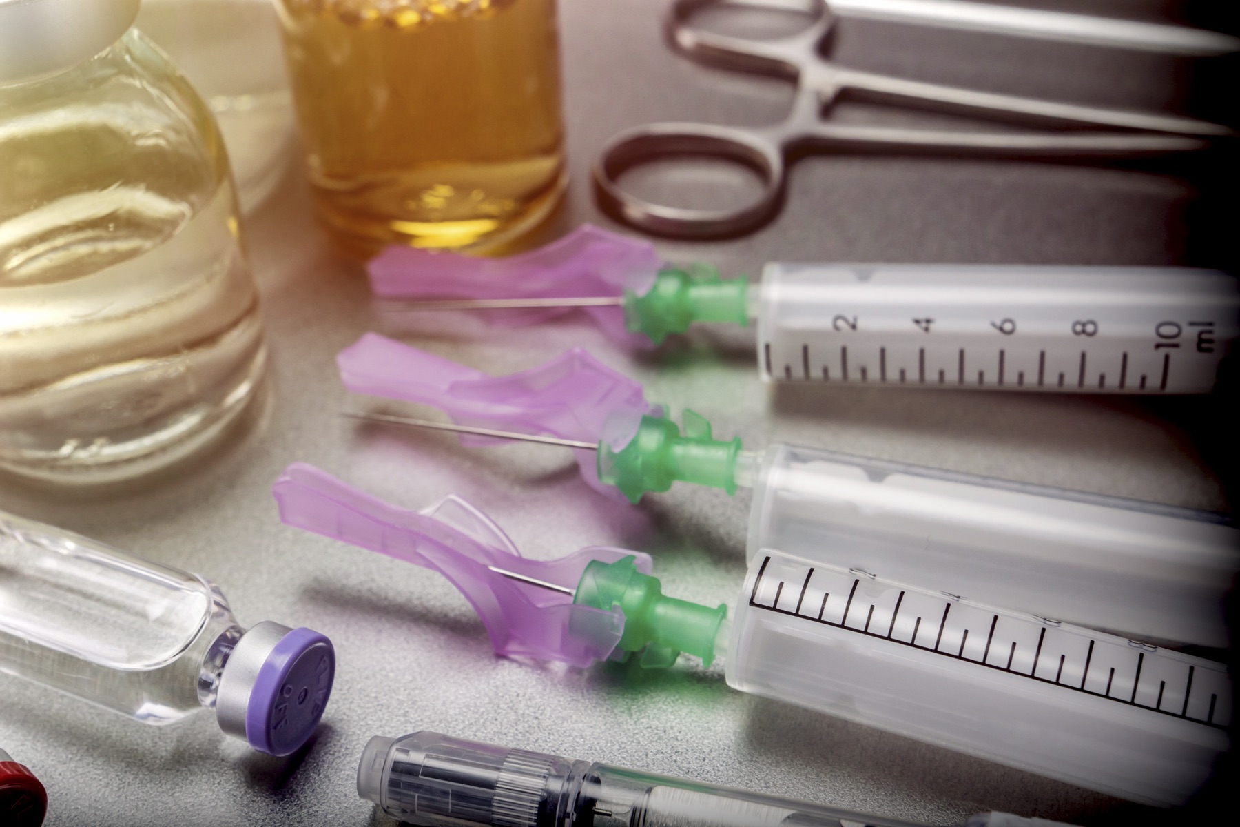 Vials of a biologic medicine on a laboratory bench
