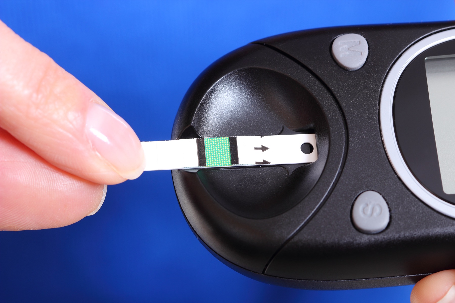 Disposable electrochemical blood glucose test strips on a laboratory bench