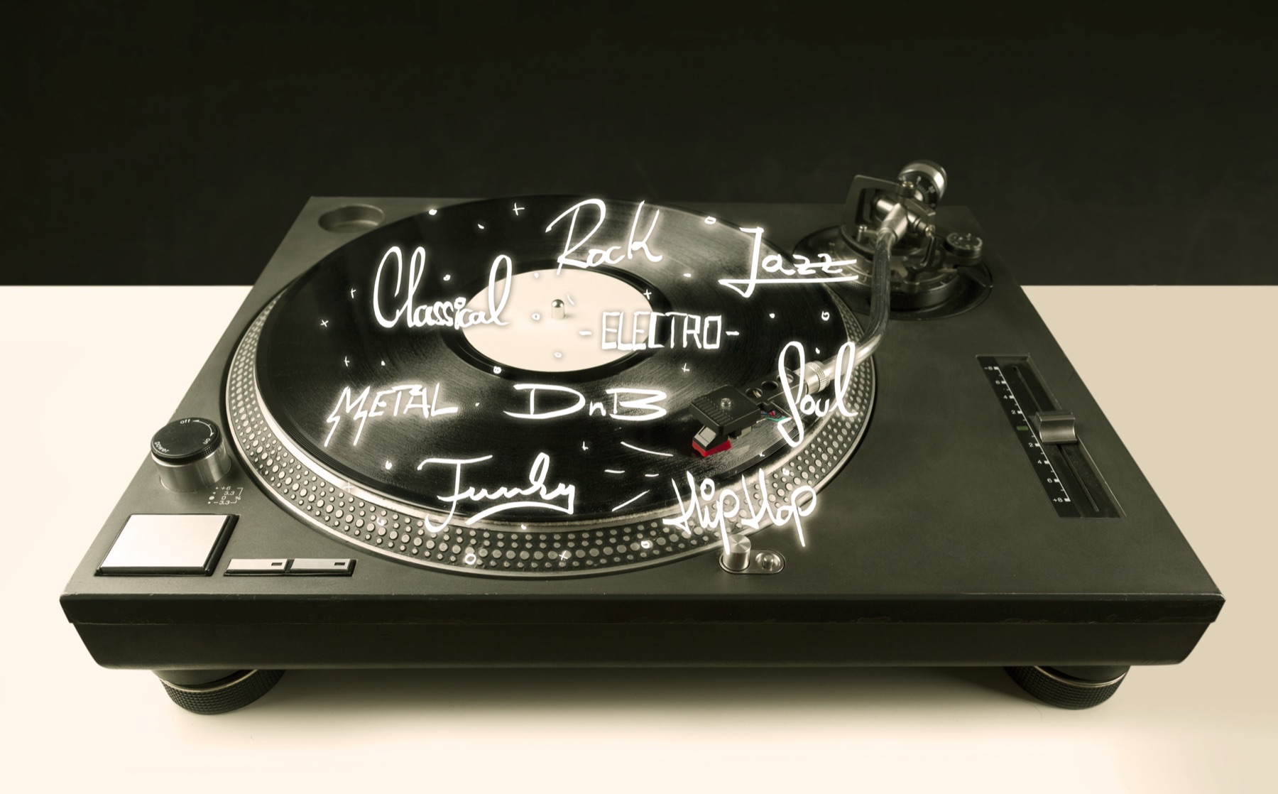 A vinyl record spinning on a vintage turntable beside a pair of go-go boots
