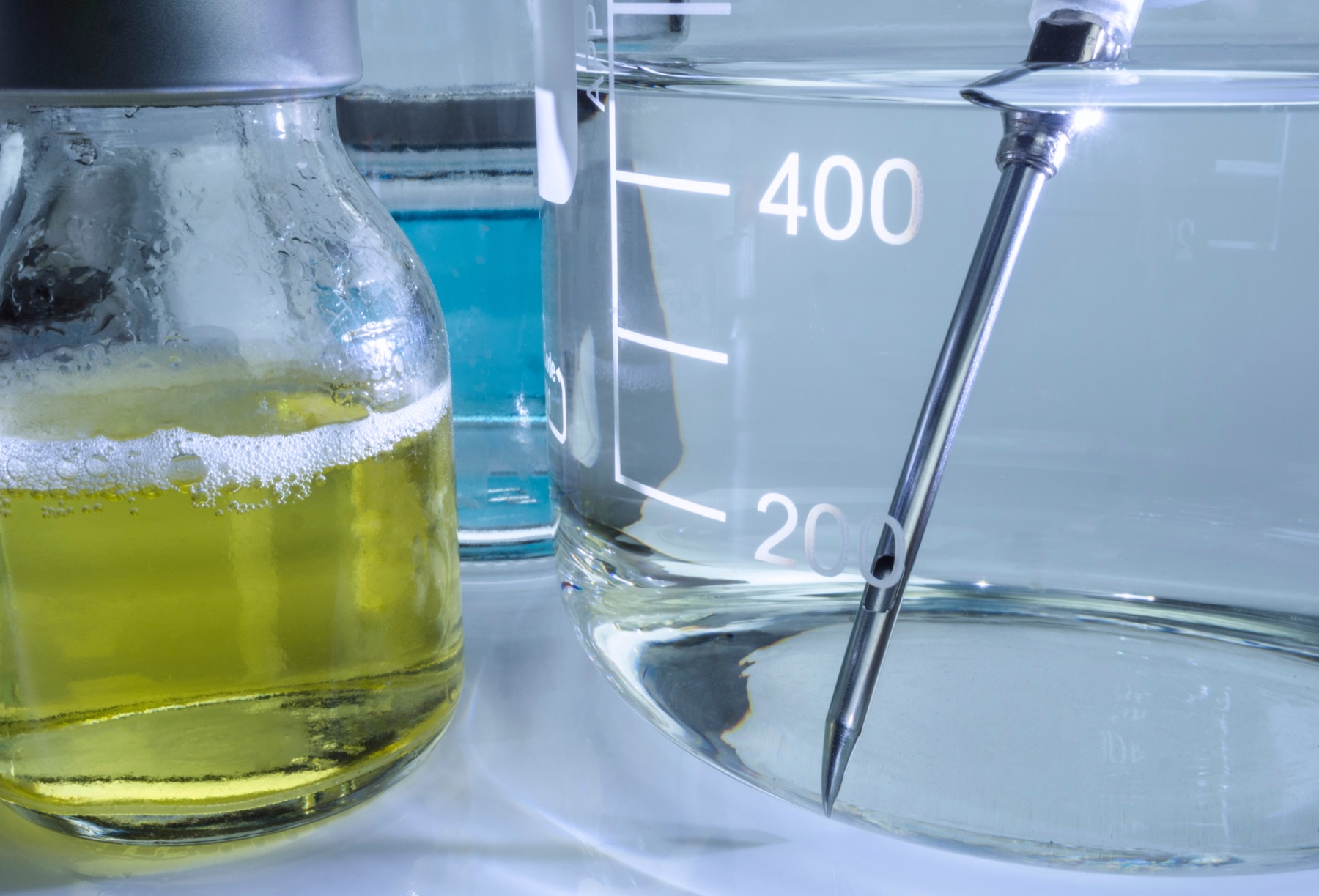 Scientist working with vials in a pharmaceutical research laboratory