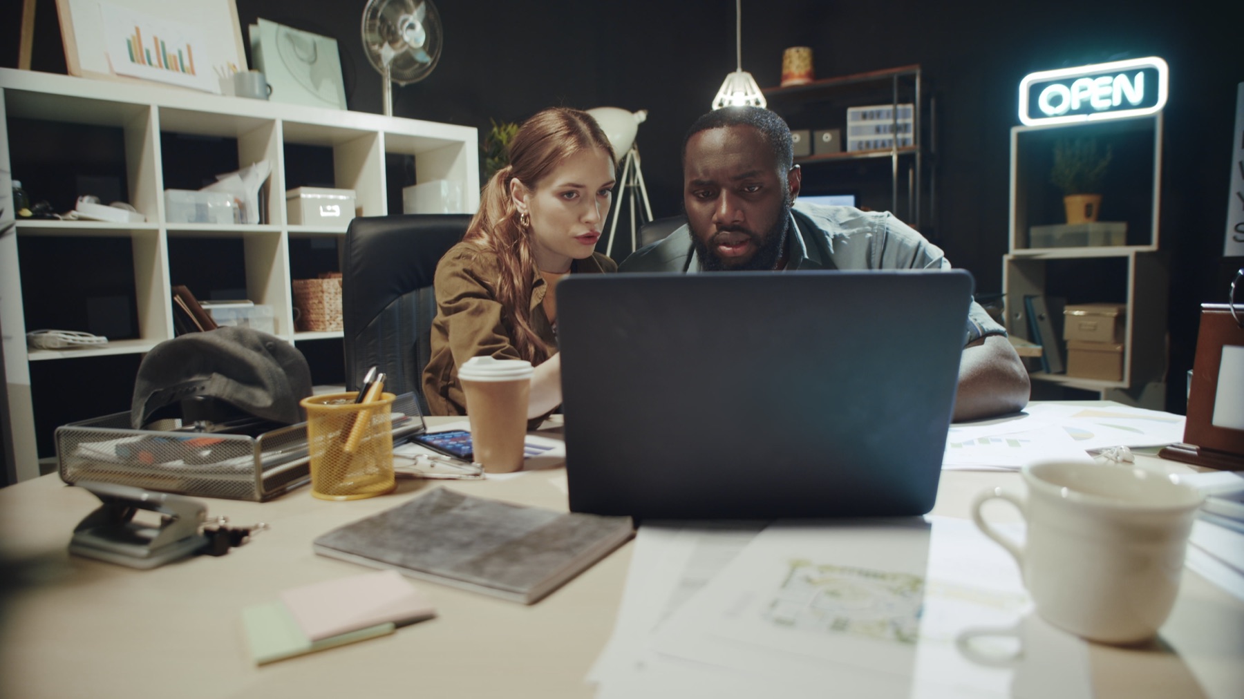 A salesperson viewing a professional network of contacts on a laptop screen