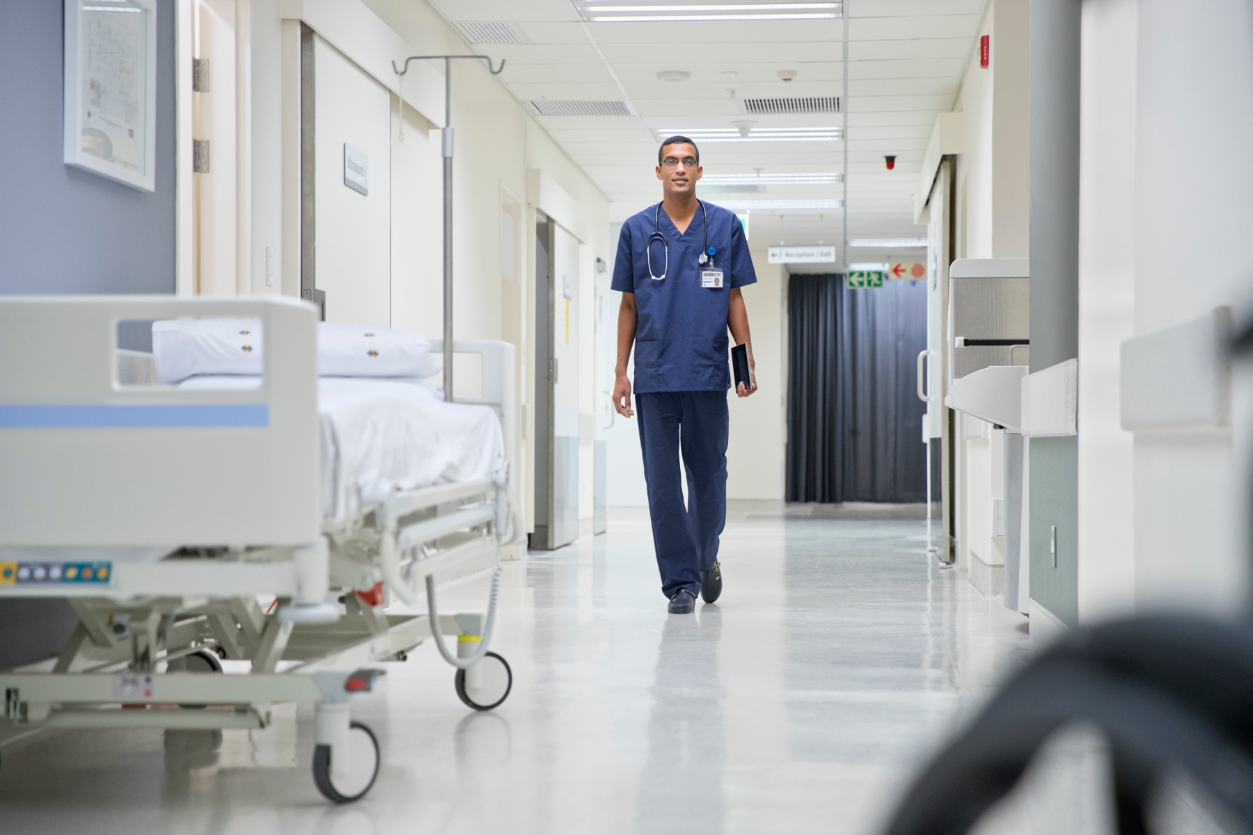 Travel nurses walking through a hospital corridor