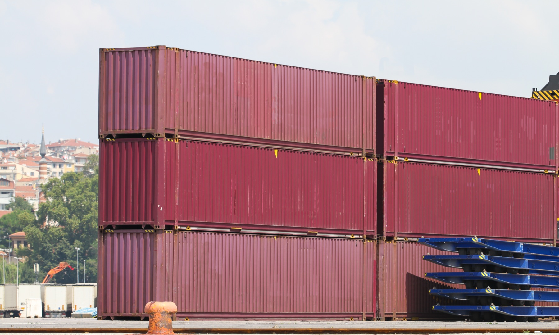 Returnable shipping containers stacked in a warehouse