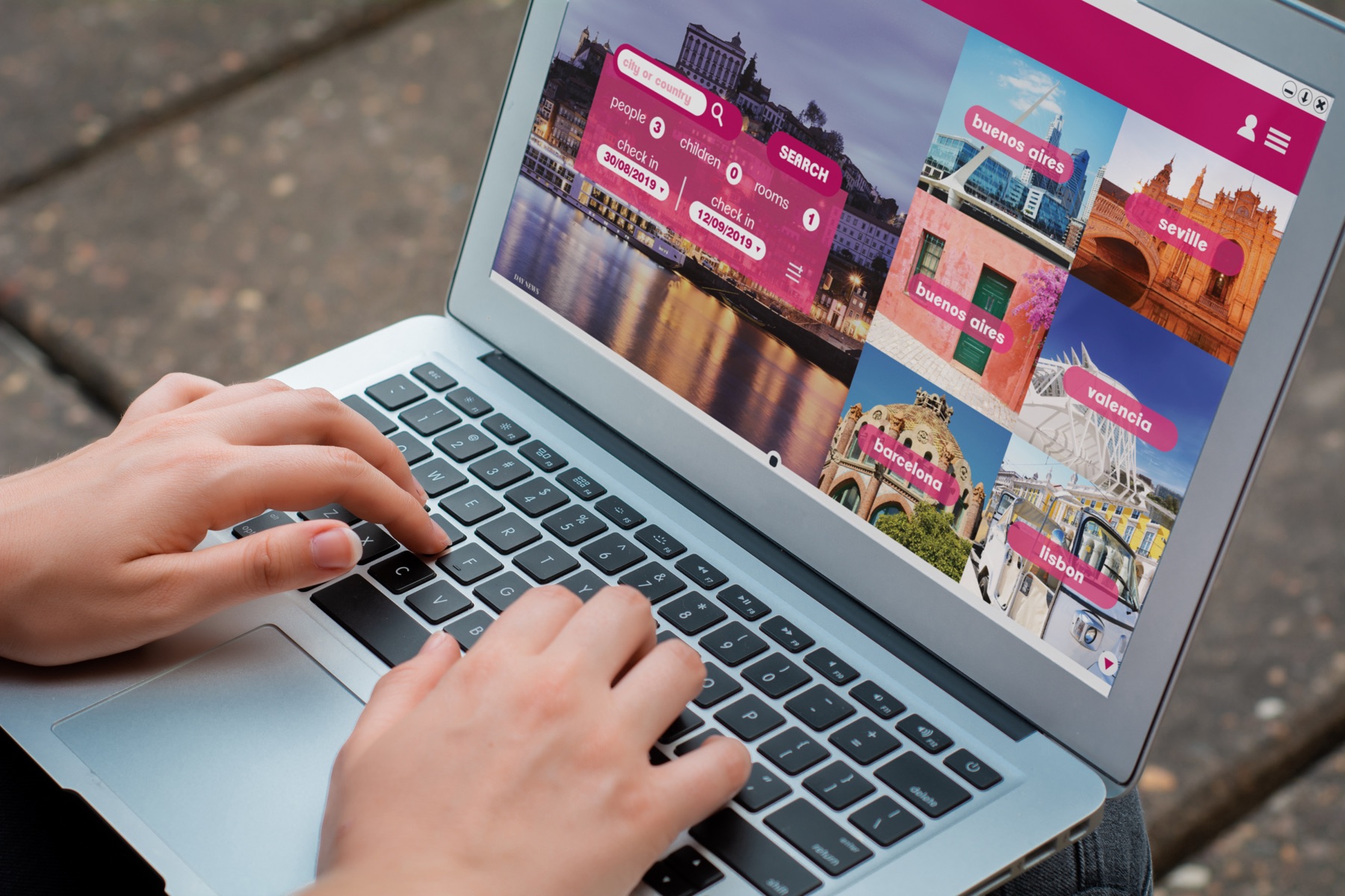 Laptop displaying a hotel-booking website with a browser address bar