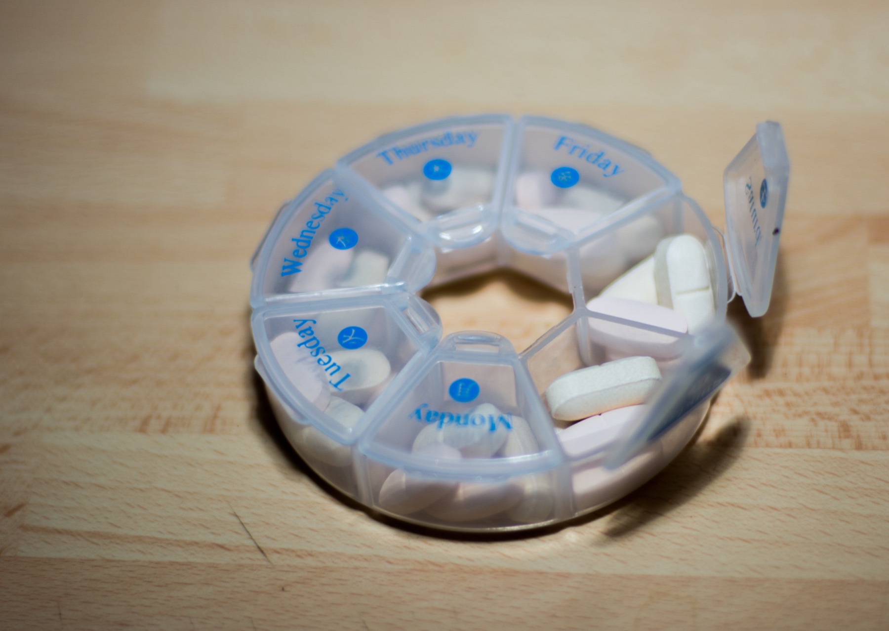 Pharmacy shelf with international pain-reliever packaging